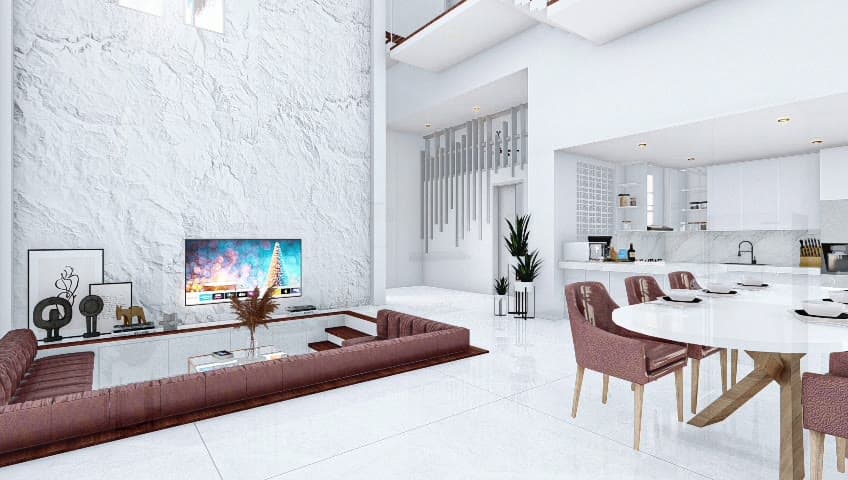 The double-height living hall at HWM Sanur, facing its rock feature wall
